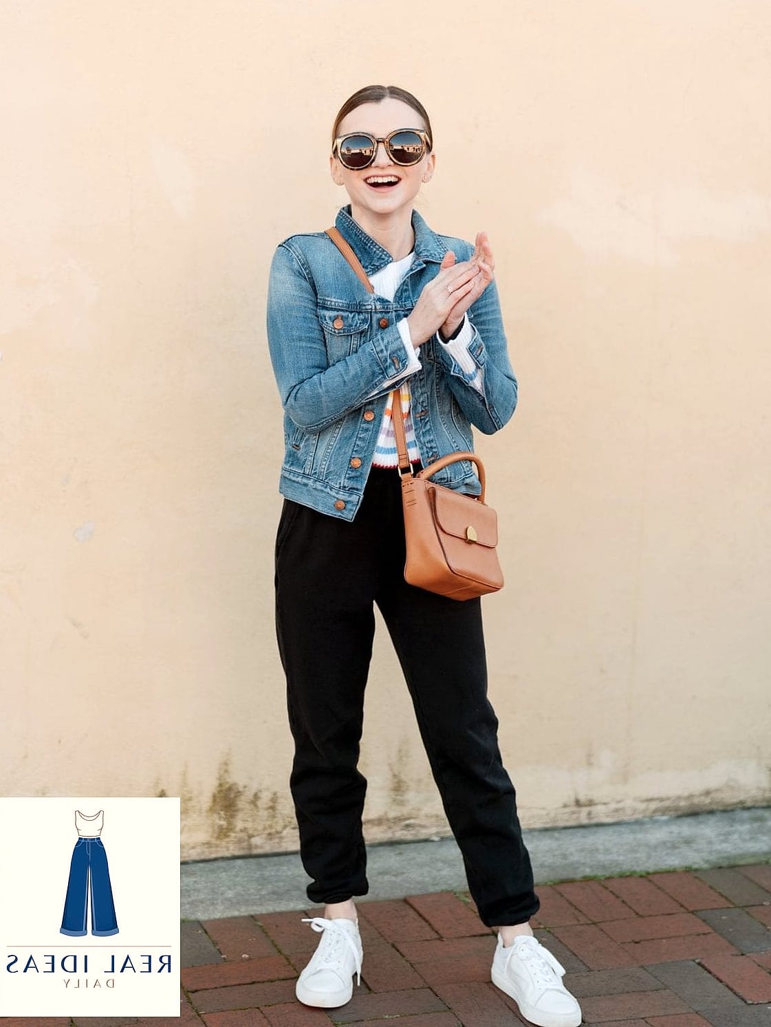 Denim jacket paired with black sweatpants and a graphic tee