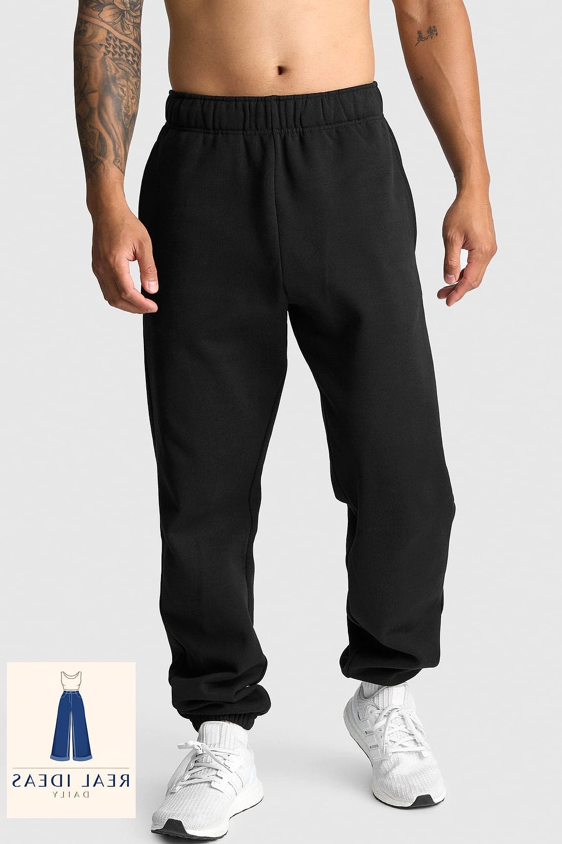 Long trench coat over sweatpants for an unexpected combo