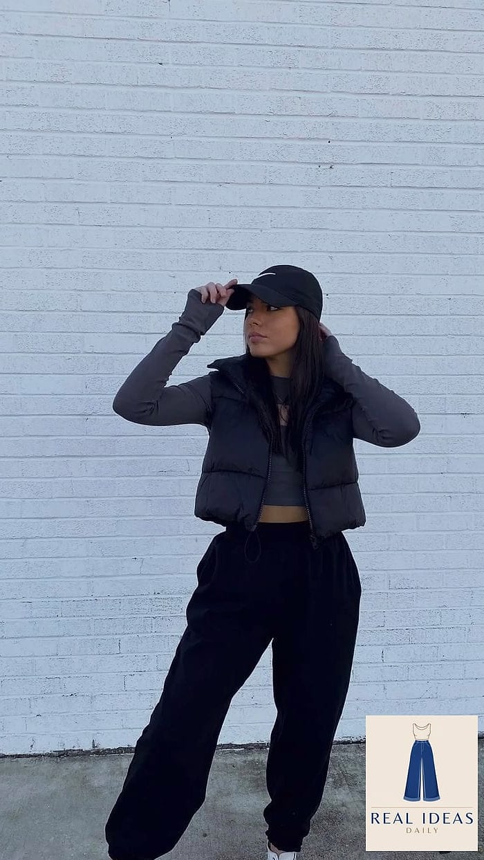 Puffer vest layered over a hoodie with sweatpants