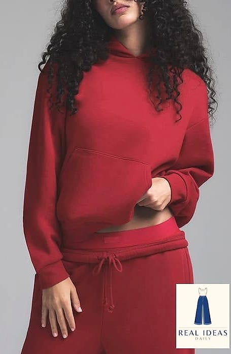 Red Hoodie Tucked Into a Denim Midi Skirt