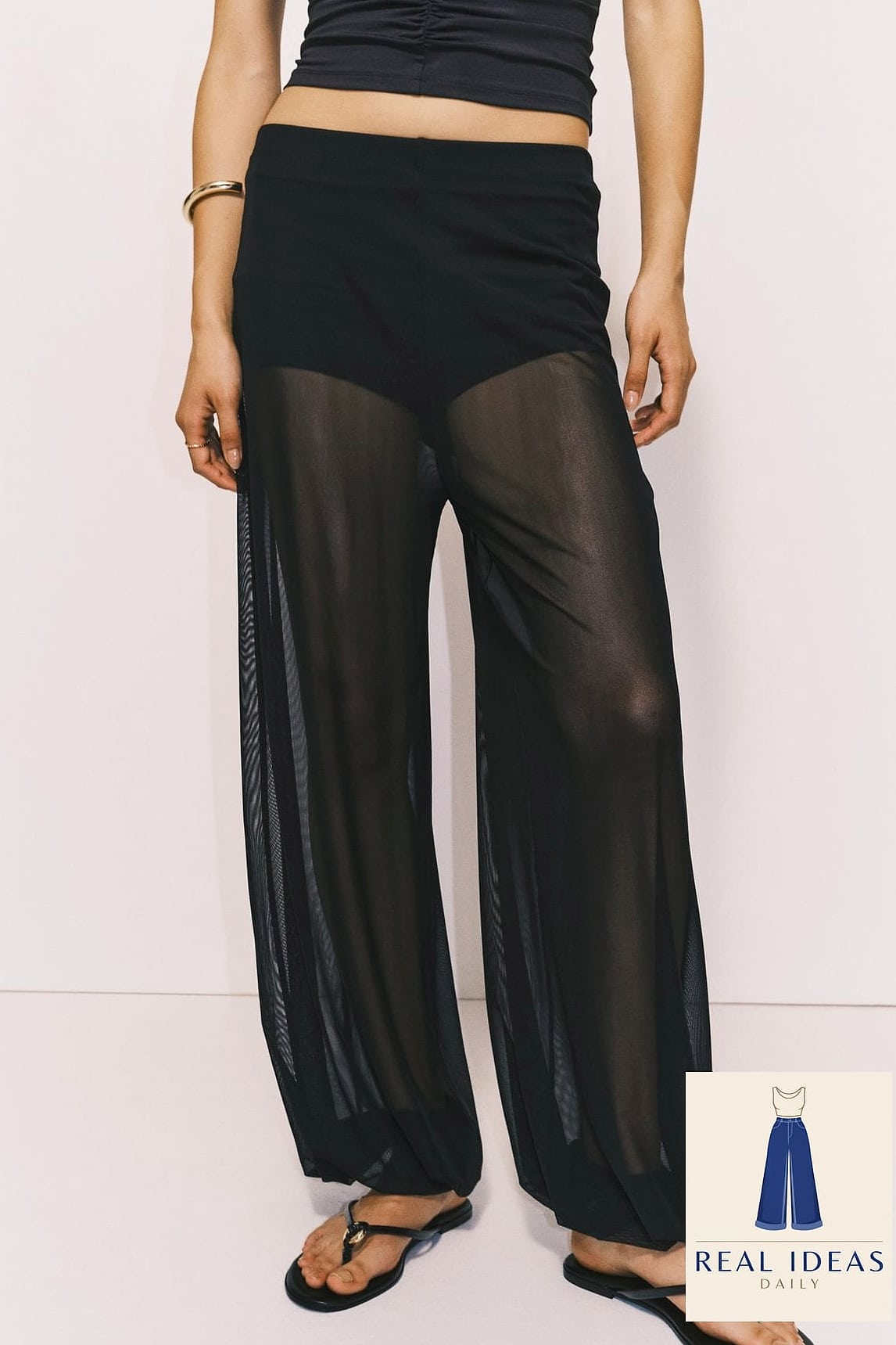 Sheer or mesh top layered over a bralette with sweatpants