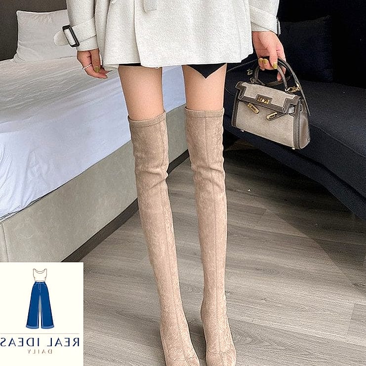 Straight-Leg Jeans Tucked Into Boots for Casual Cool