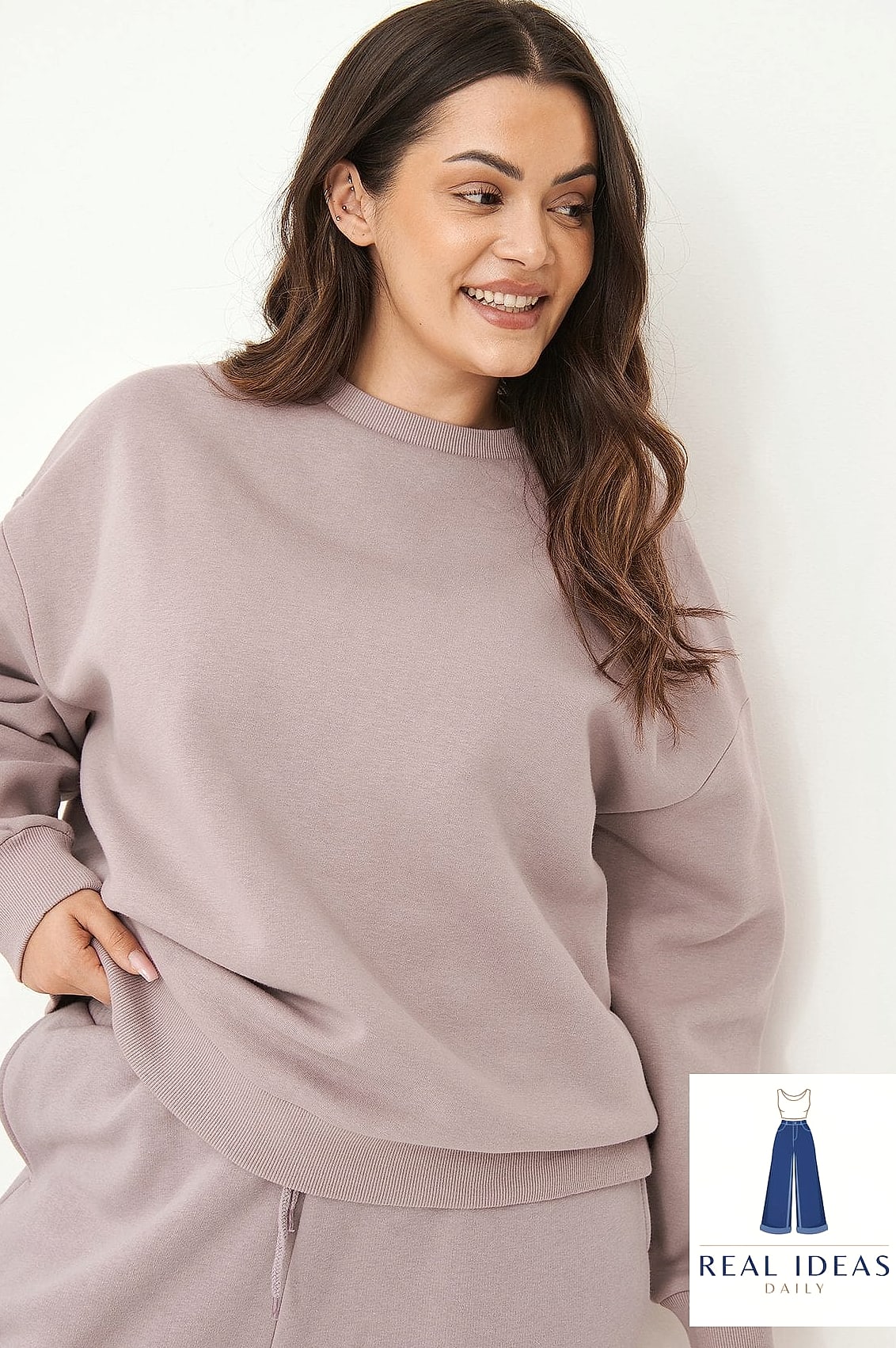 Sweatshirt with Chunky Knit Cardigan Layered Over It